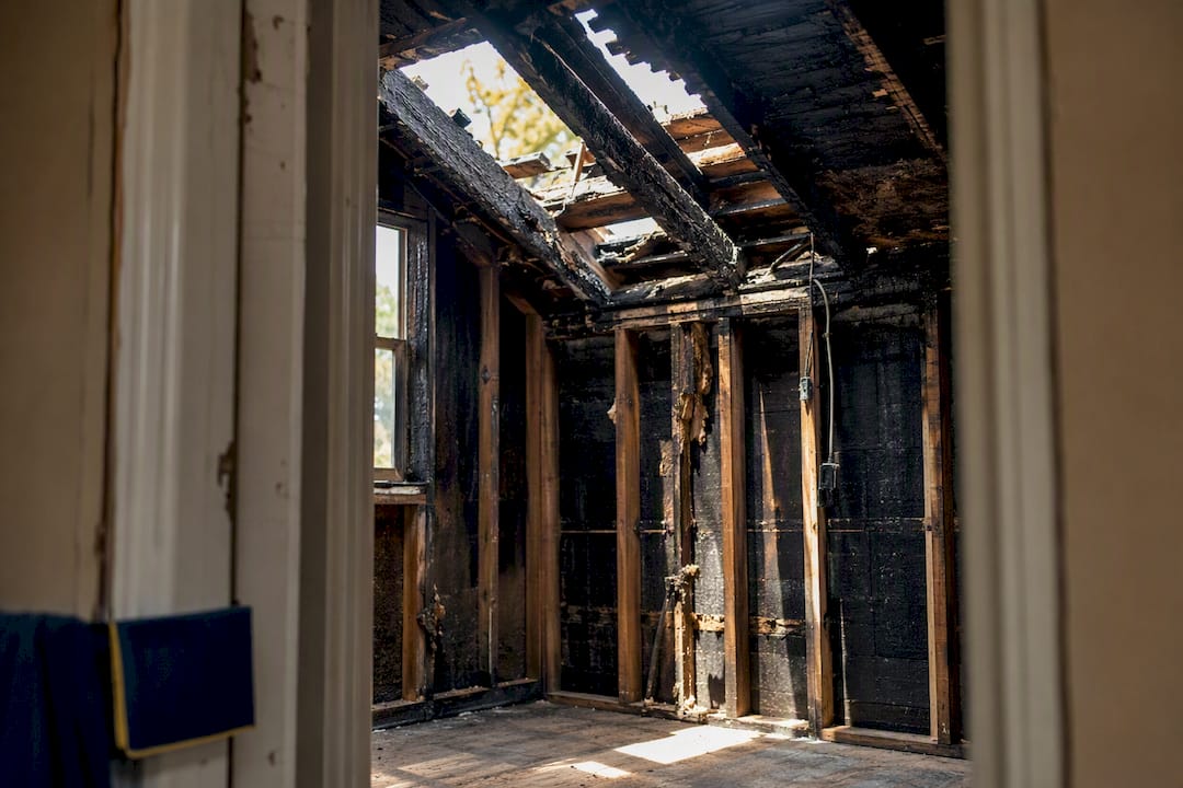 Charred framing and damaged roof section